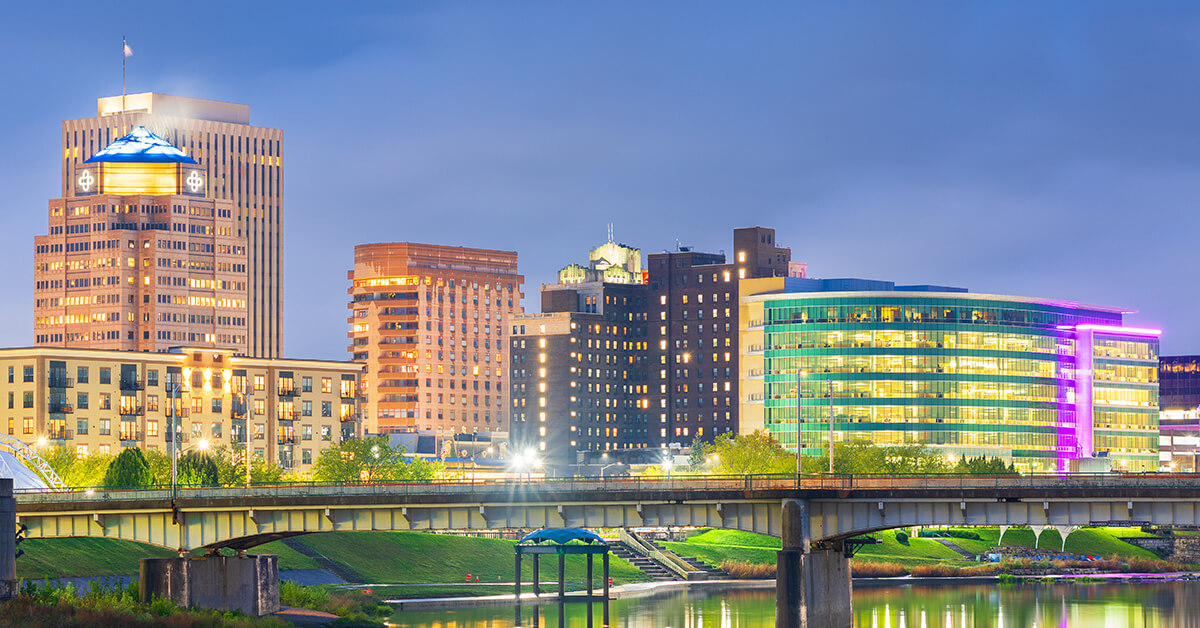 Image of Downtown Dayton Skyline at night in preparation for NATO 2025