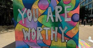 Photo of Chalk Mural from Arts in the City 2025 that says "You are Worthy"